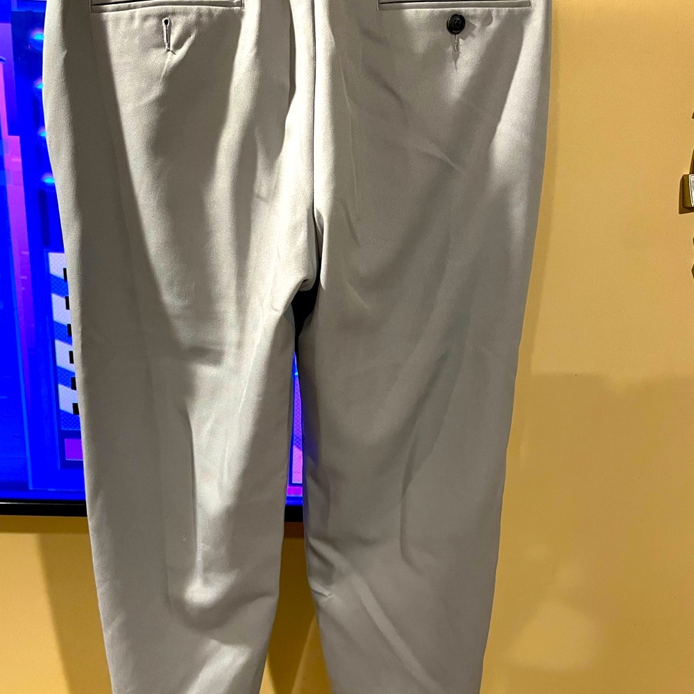 Men’s dress pants. Only call out is small black markings near top of left side